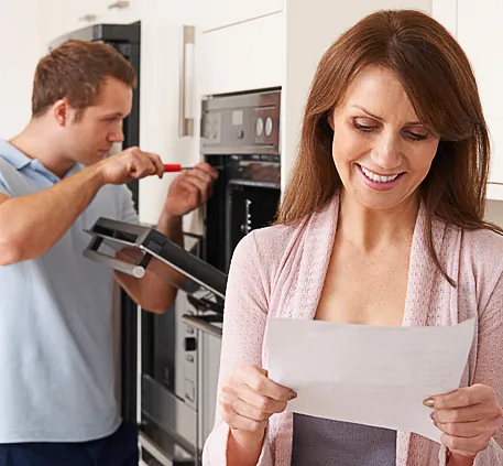 Woman Getting Her Appliances Repaired